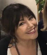 An image of Serena Kitt, interior designer and owner of Kitt Interiors, smiling.